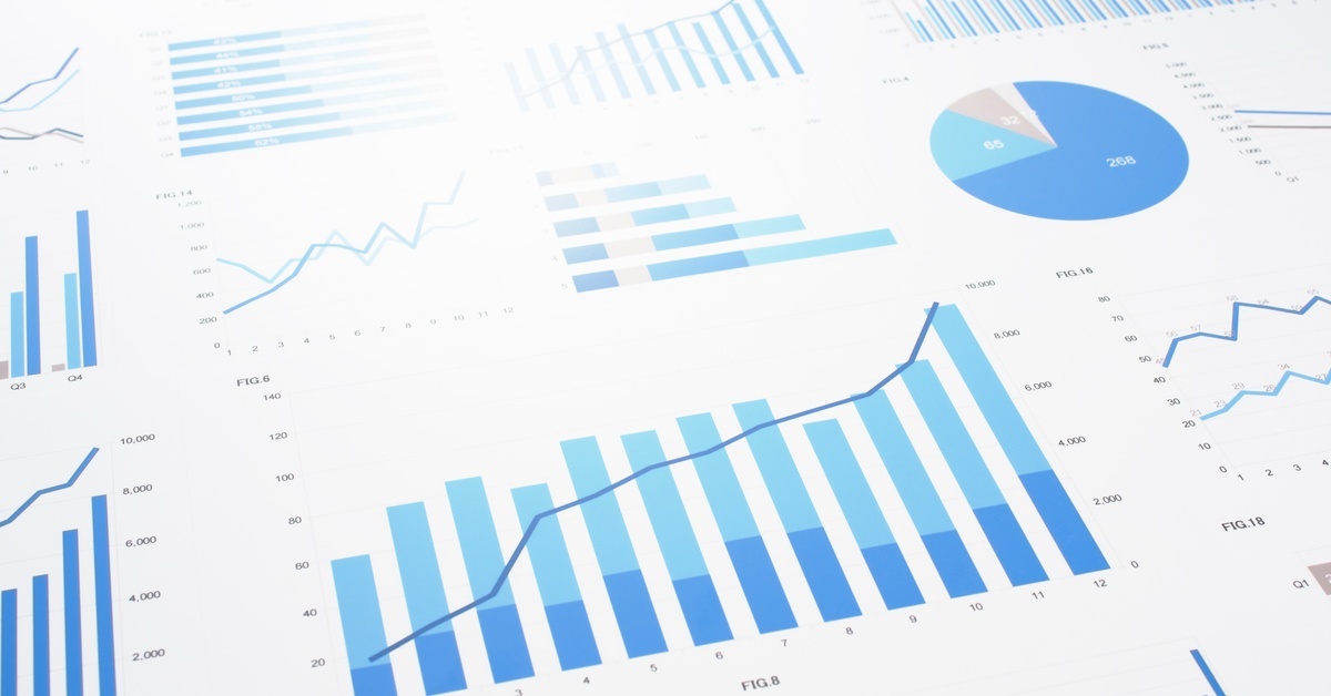A white sheet of paper displaying an assortment of collected data presented as predominantly blue graphs and charts.